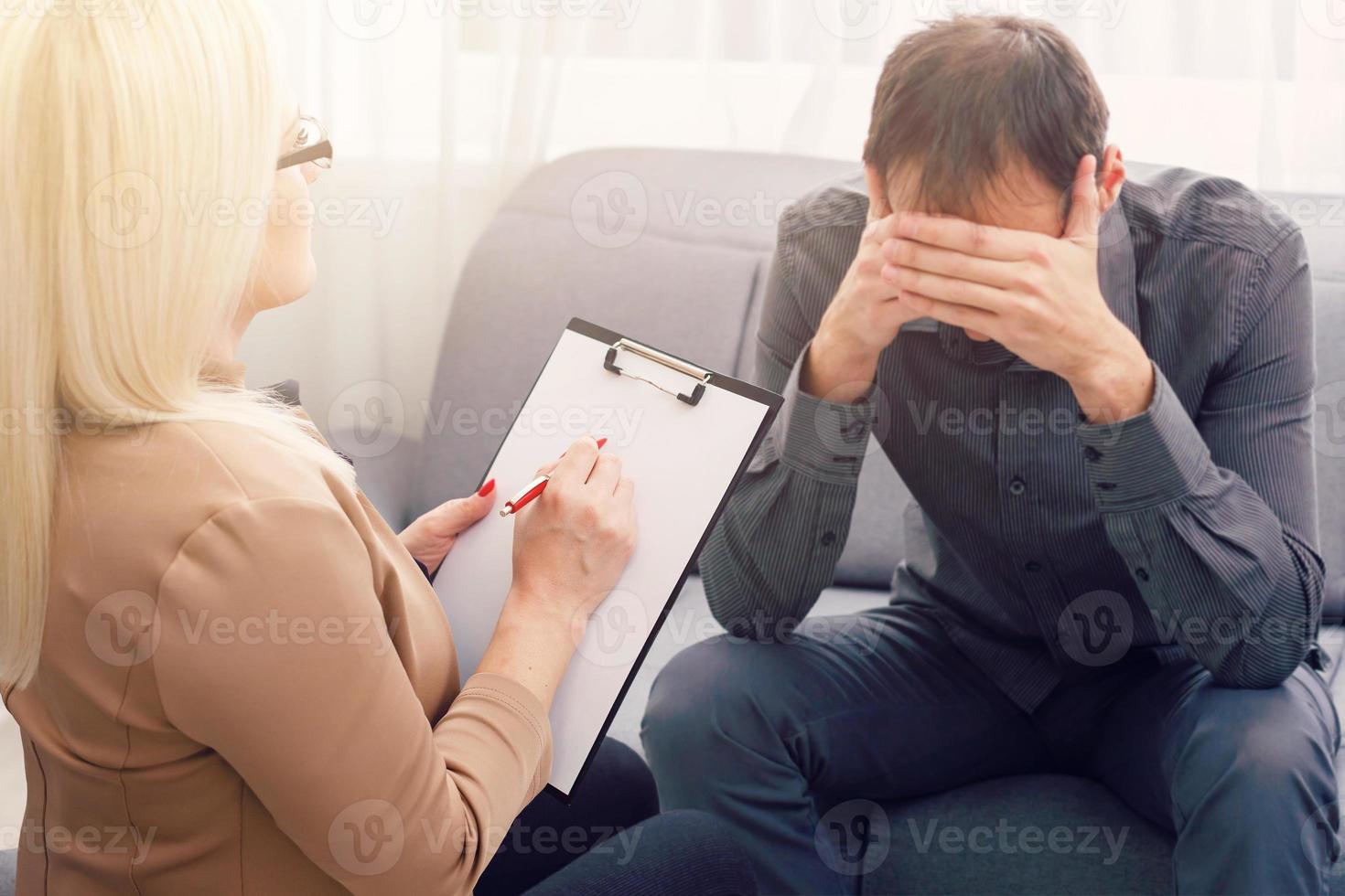Psychologist having session with her patient in her private consulting room photo