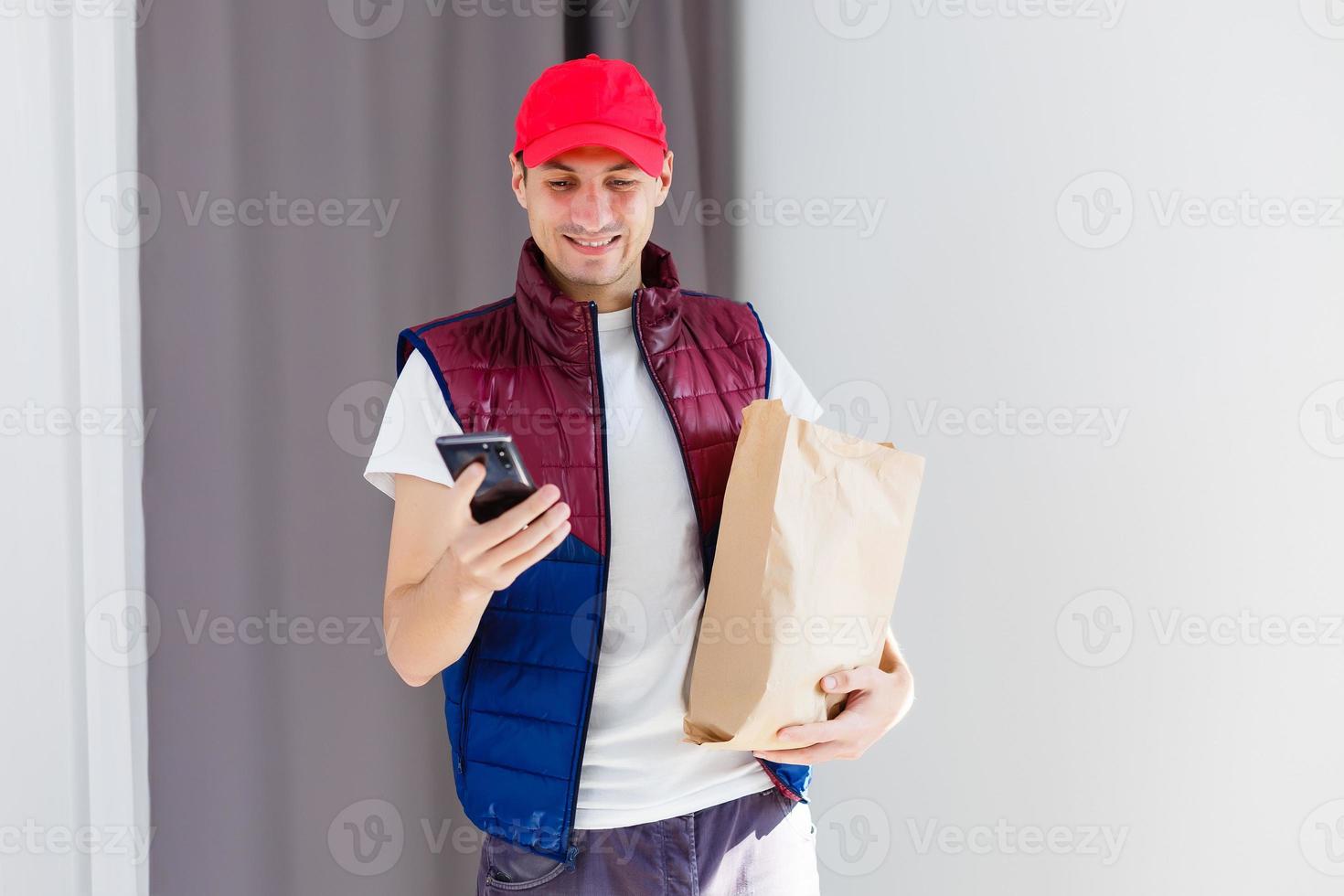 Paper container for takeaway food. Delivery man is carrying photo