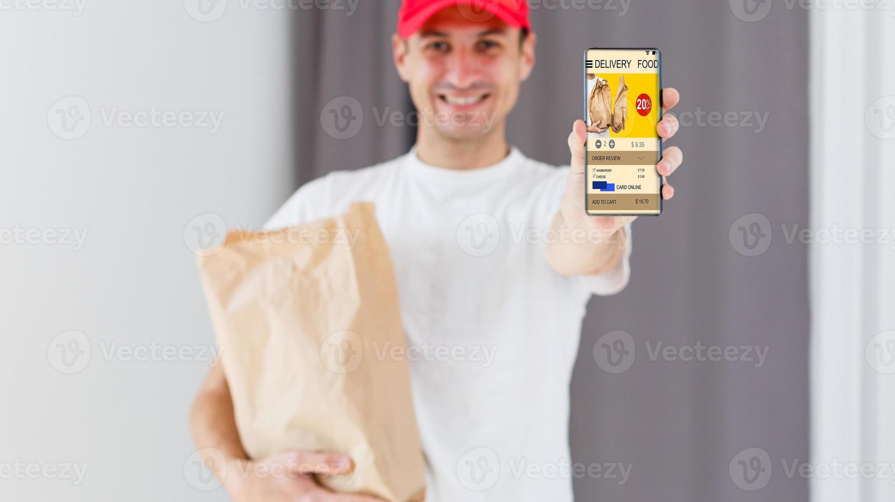 Paper pocket and food containers in hands of a smiling deliveryman. Quality service of a restaurant. photo