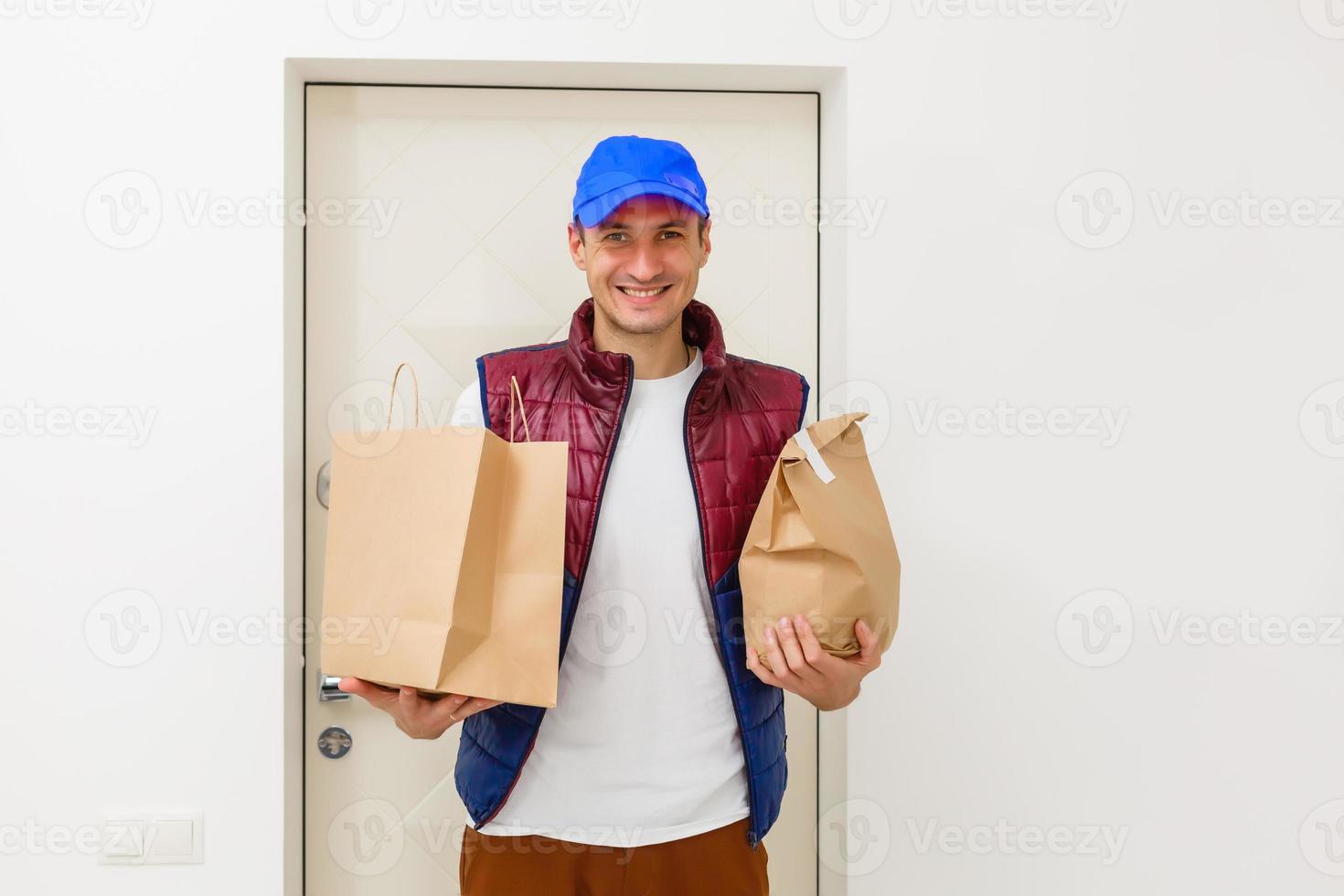 Fast delivery service manager bringing package to female client photo