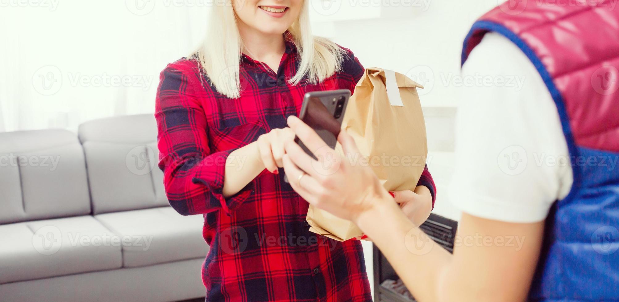 Man food delivery in an apartment photo