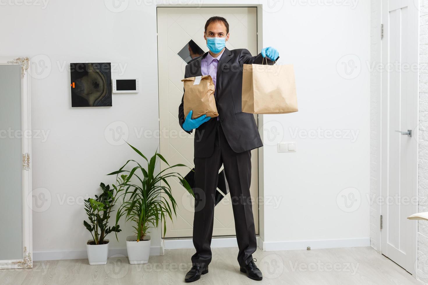 food delivery man Wearing Medical Mask. Corona Virus Concept photo