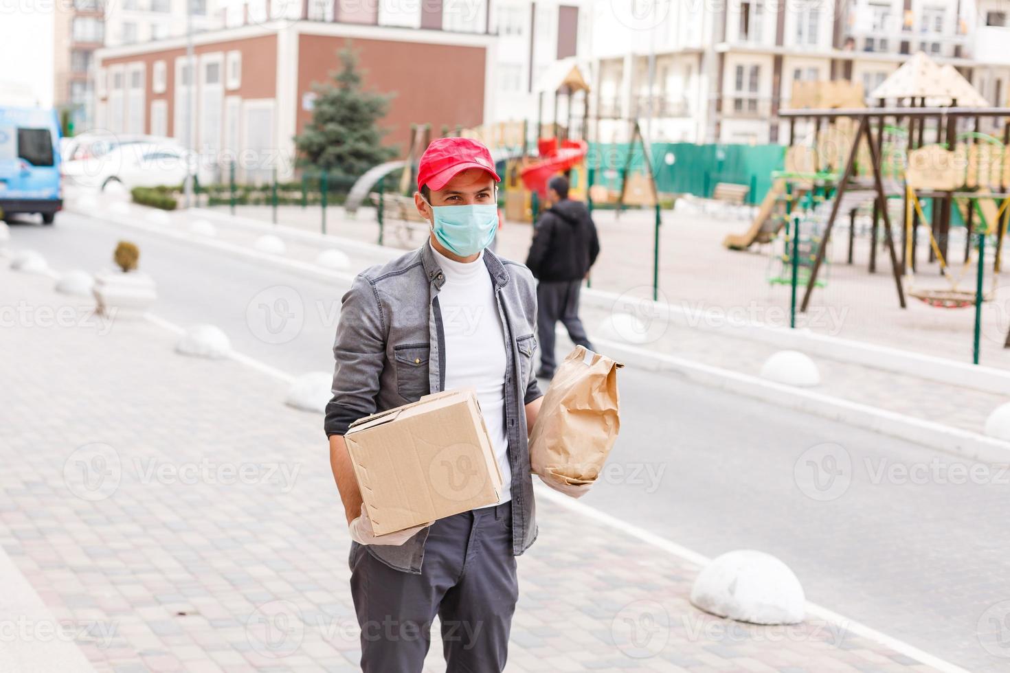 food delivery man in protective mask photo