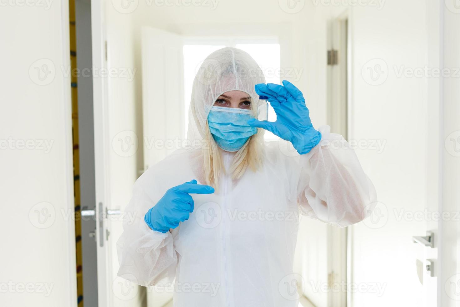 Chinese woman weared in protective suit. Gas mask as a protection against many infections and allergens. Health care worker. photo