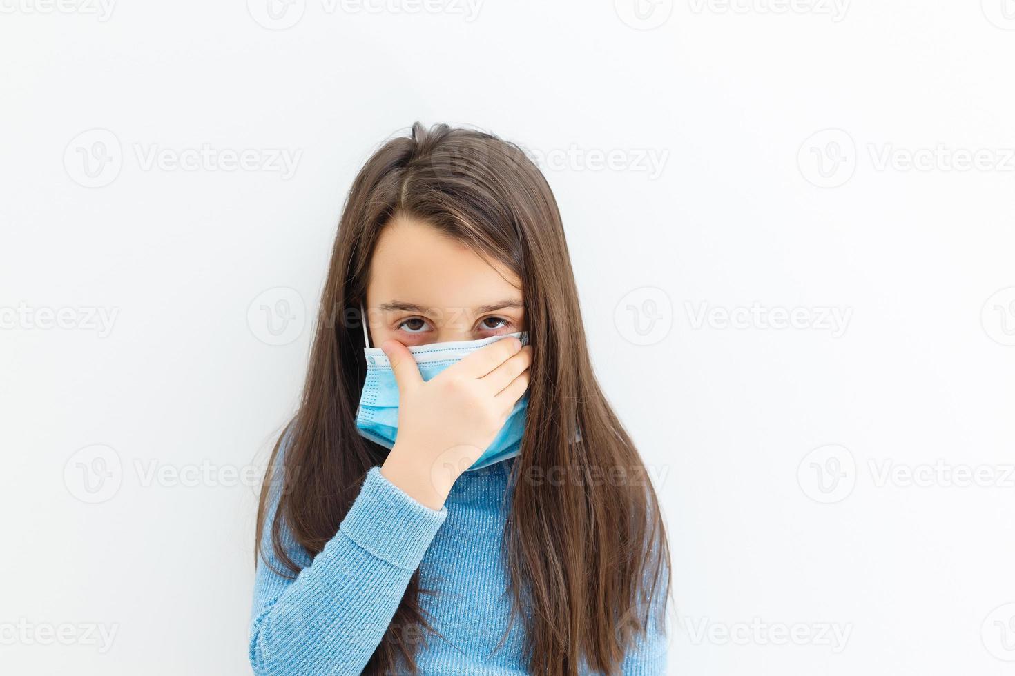 Little girl wearing a protective mask photo