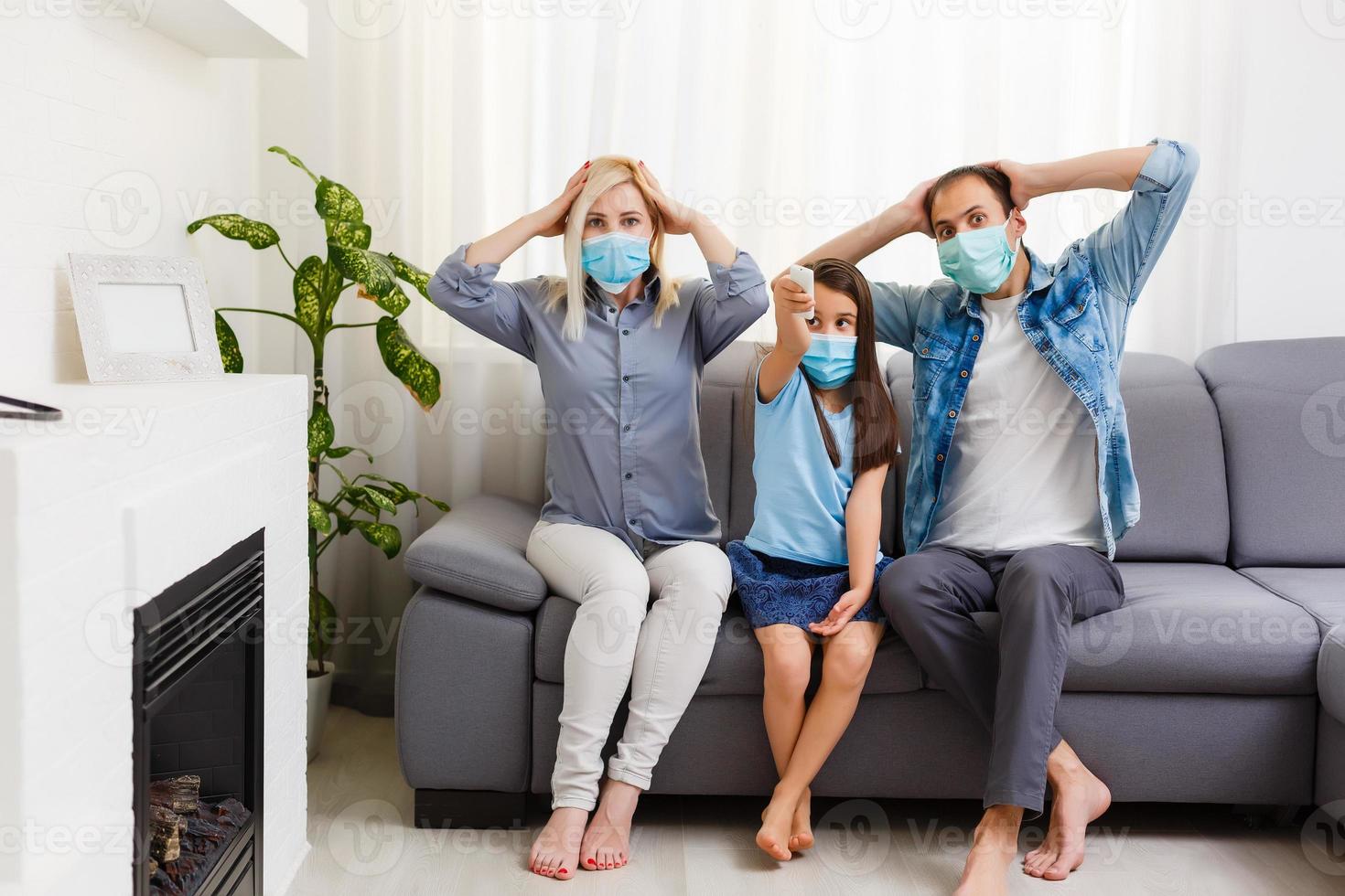 family On The Sofa Watching tv at home. Stay at home during quarantine photo