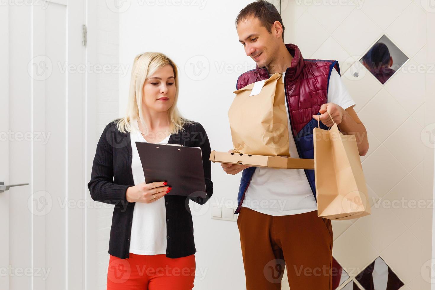 Man food delivery in an apartment photo