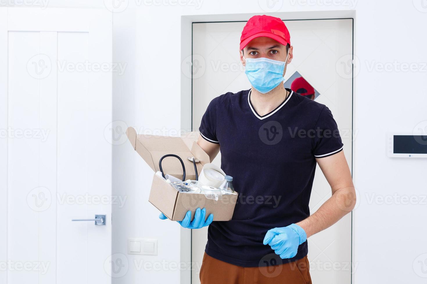 Delivery man holding cardboard boxes in rubber gloves and medical mask. copy space. Fast and free Delivery transport . Online shopping and Express delivery photo