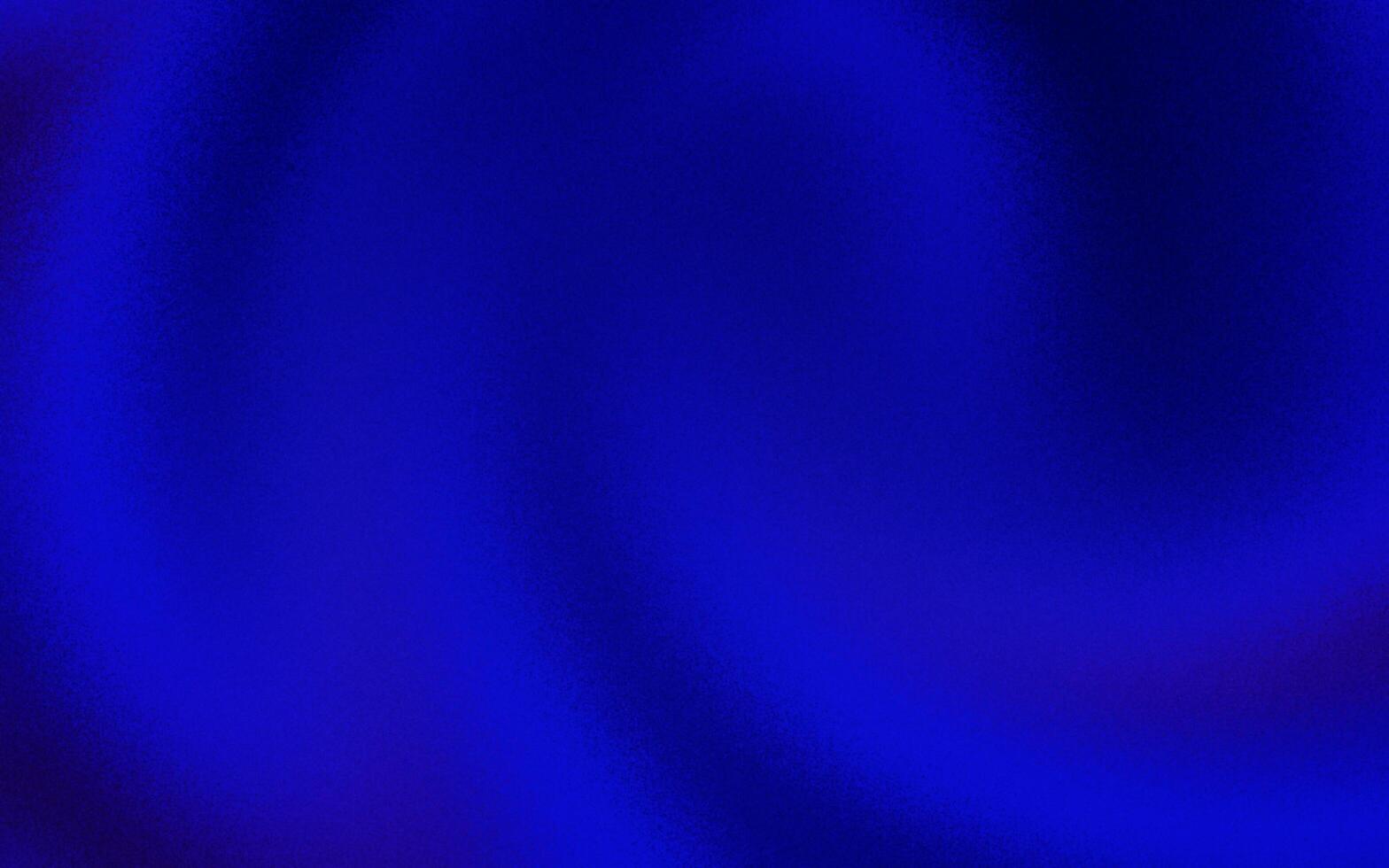 Fashionable blue gradient background with noise or grain textures. Blue grunge texture background. Blurred gradient background. Sprayed gradient with the grain or noise effects. photo