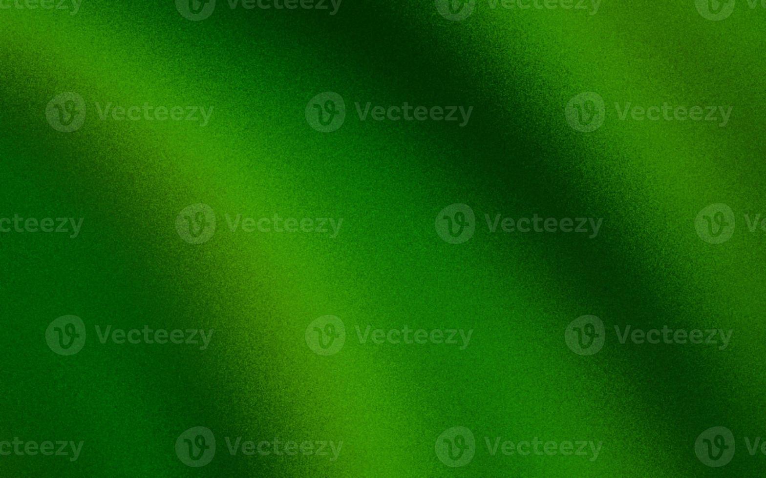 Attractive green gradient background with noise or grain textures. Green grunge texture background. Blurred gradient background. Sprayed gradient with the grain or noise effects. photo