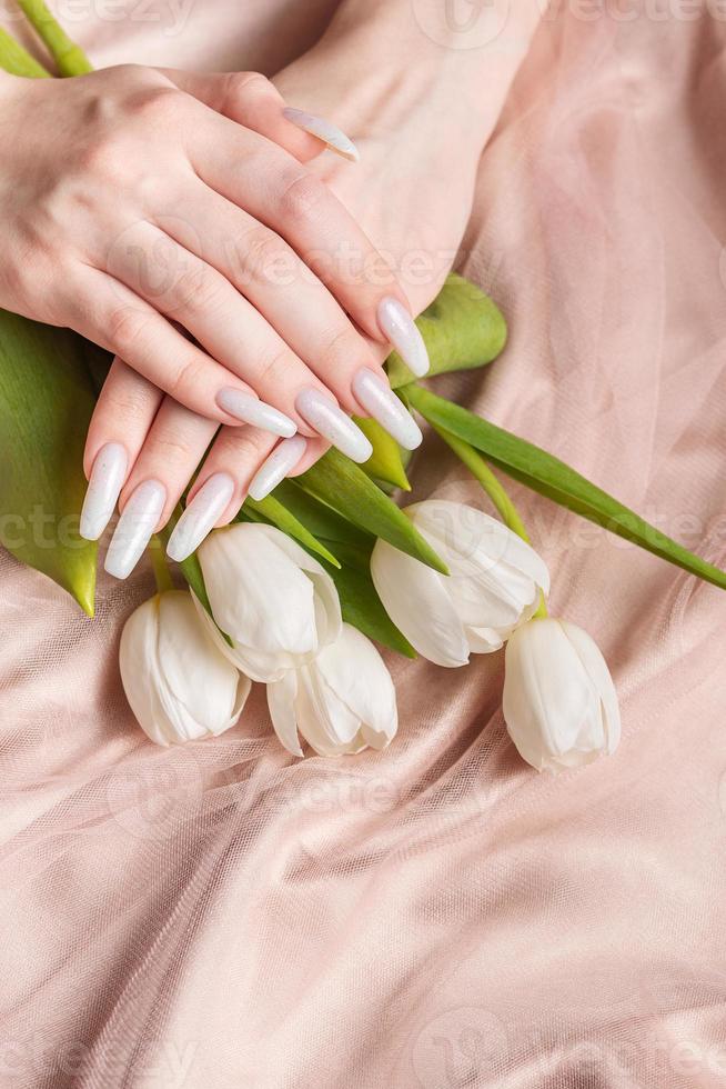 Female hand with spring nail design. photo