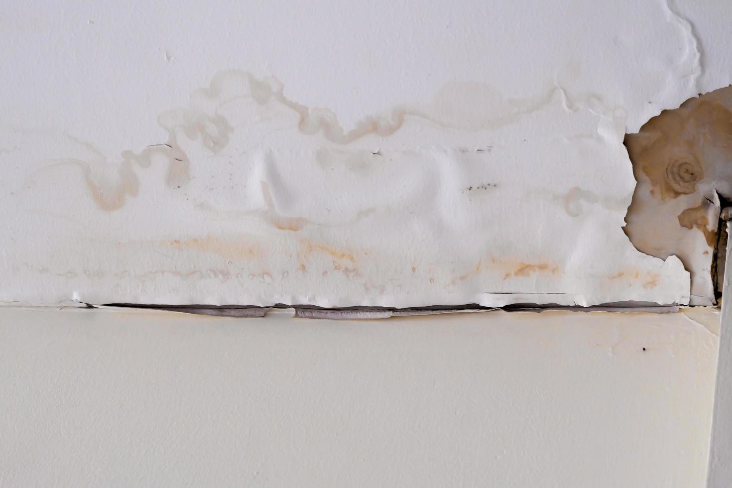 Water damaged ceiling  roof in an old abandoned house. photo