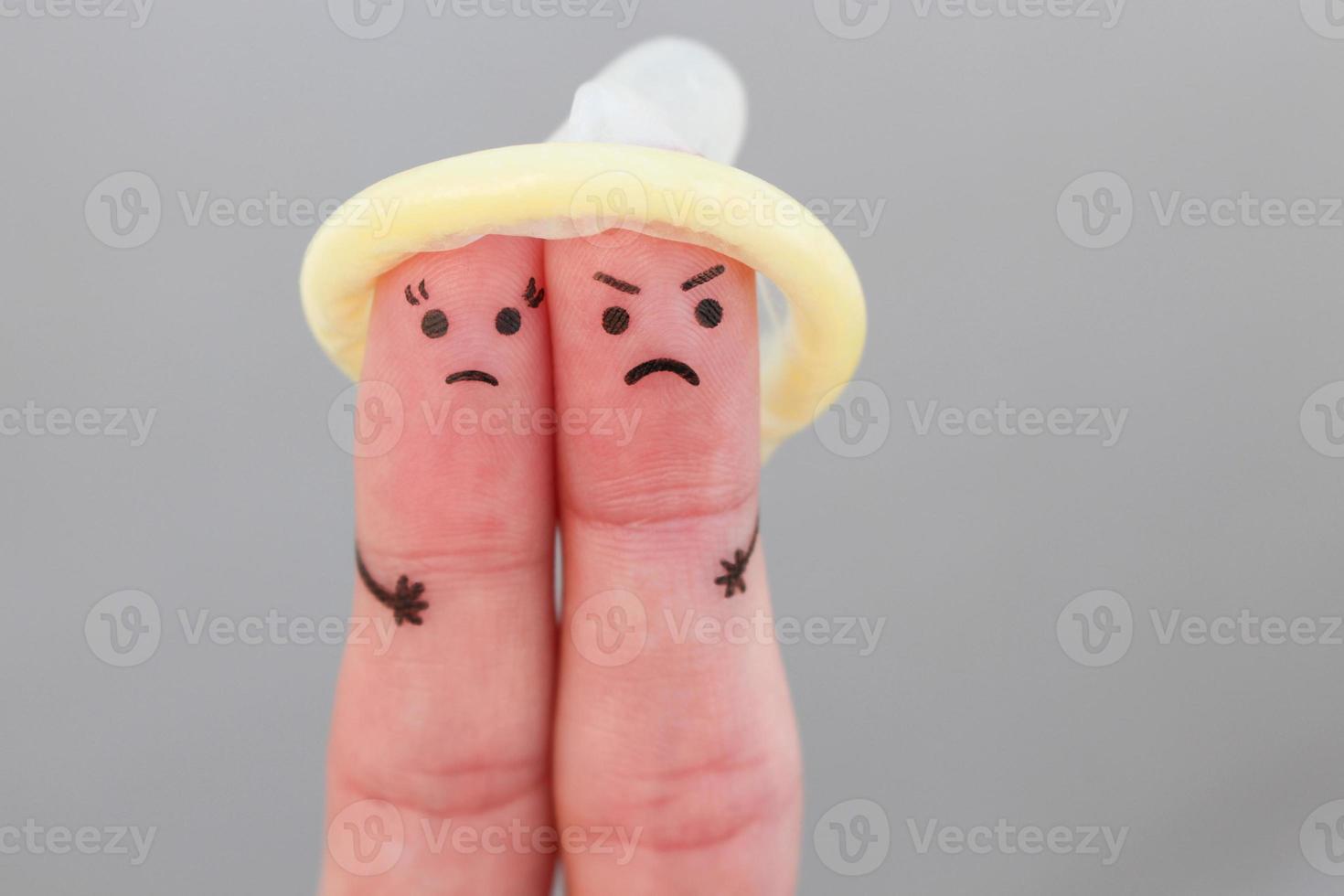 Fingers art of couple. Concept of man and woman refuse to use condom. Unprotected sex. photo