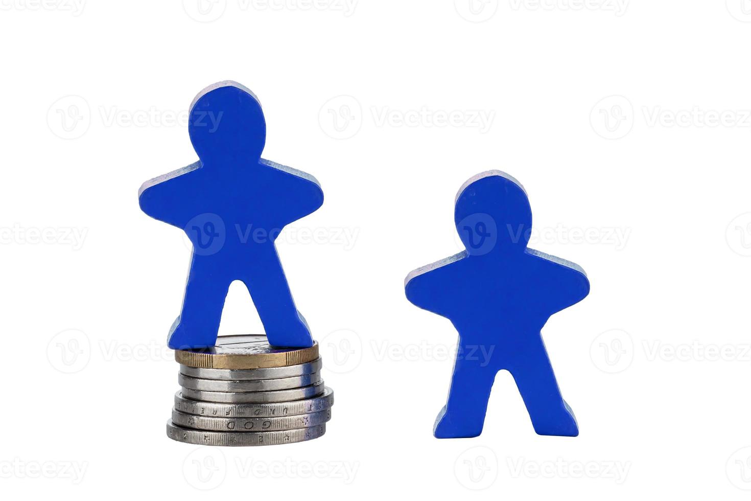 Wooden human figure on stack of coins for business concept photo