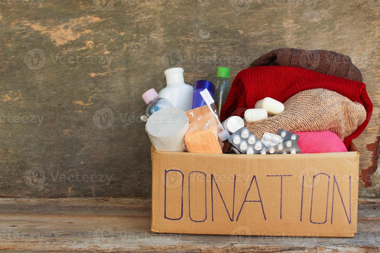 Donation box with clothes, living essentials photo