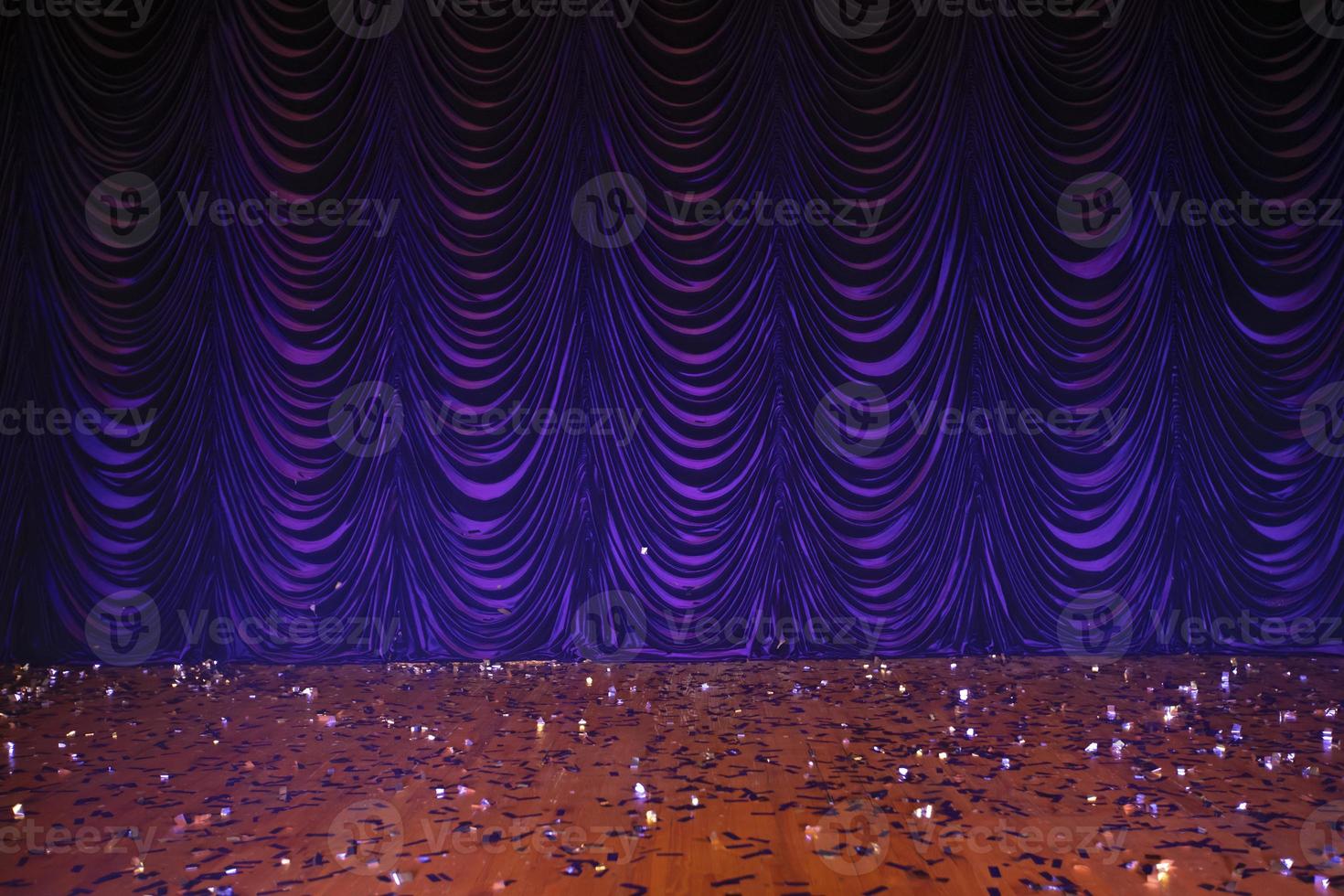 Theatrical background. Purple stage curtains and floor. photo