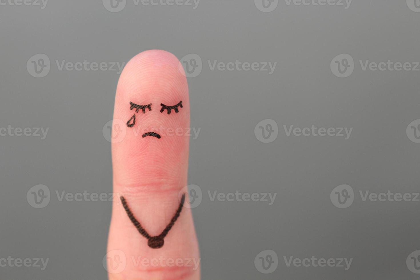 Finger art of lonely woman is crying. photo