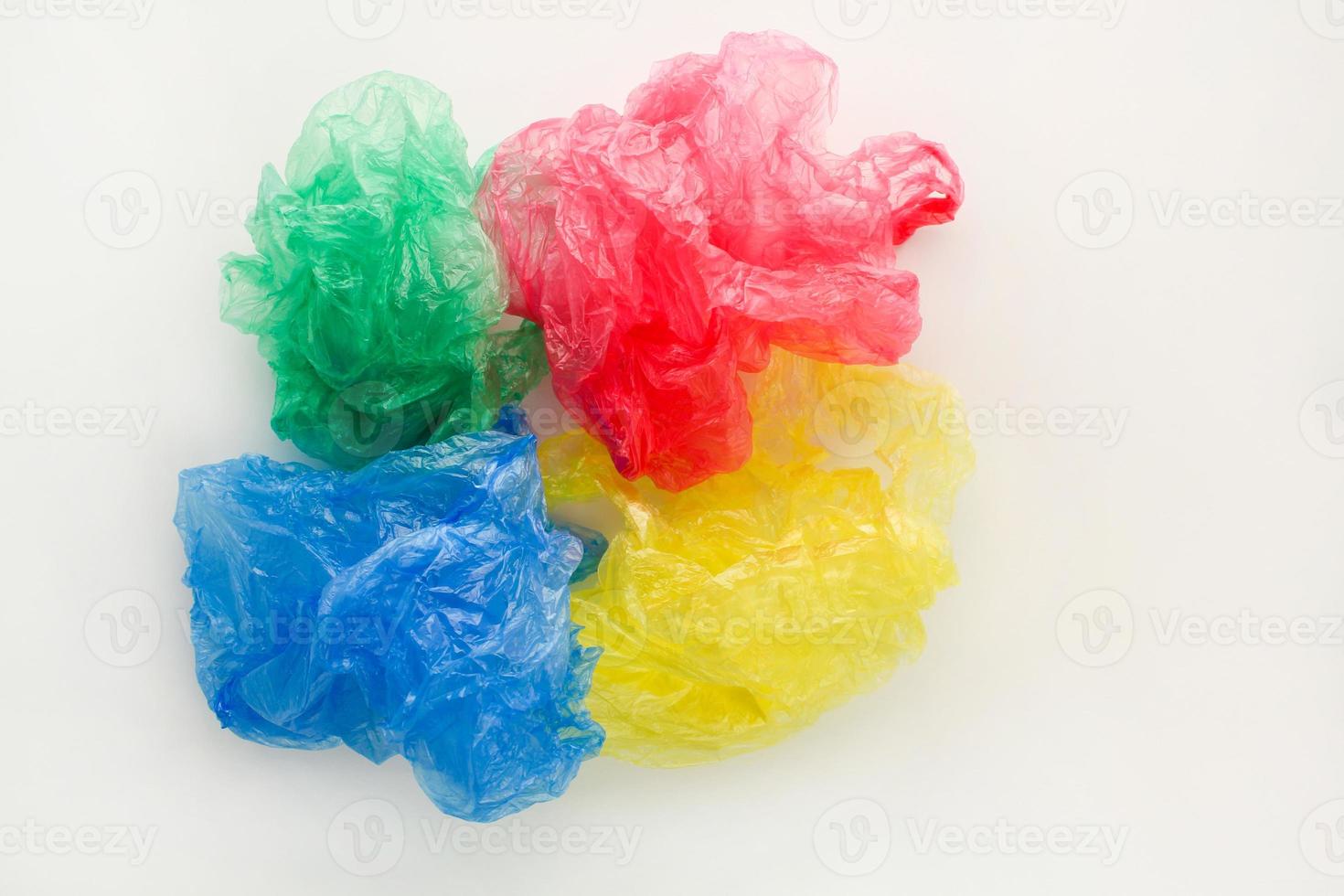 Different plastic bags on wooden background. photo