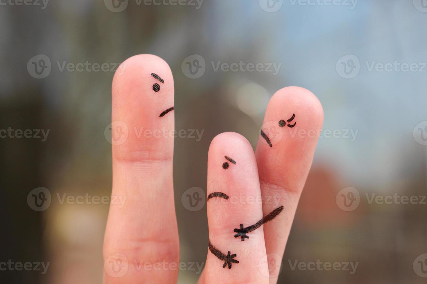 Finger art of family during quarrel. Concept of divorced parents. Idea mother does not gives the child to communicate with his father. photo