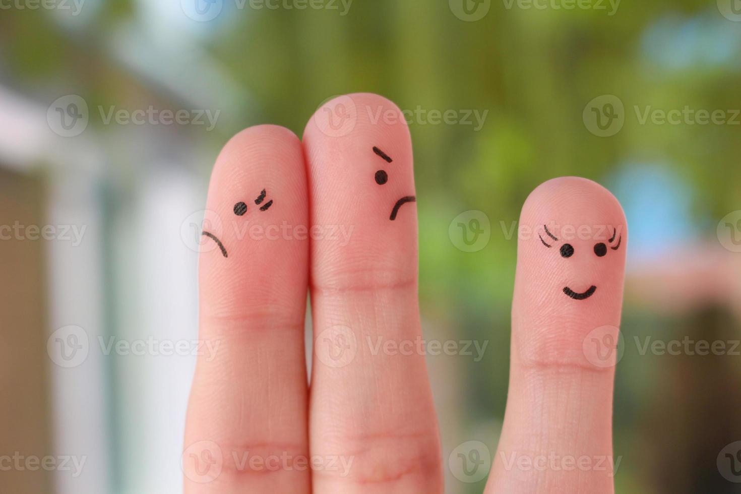 Finger art of family during quarrel. A couple arguing, another woman is happy. photo