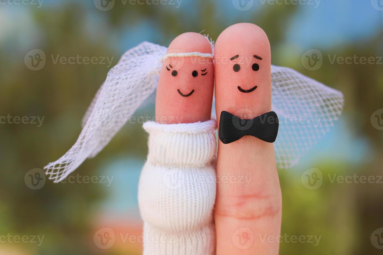 Fingers art of a Happy couple. Concept of shotgun wedding, woman is pregnant and man needs to get married. photo