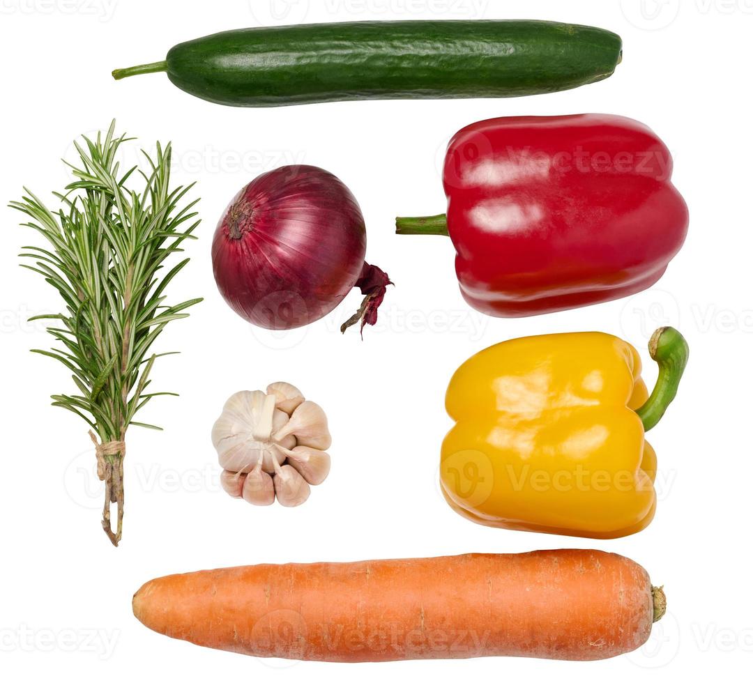 Fresh vegetables, onion, carrot, yellow and red bell peppers, a bunch of rosemary on a white isolated background. photo