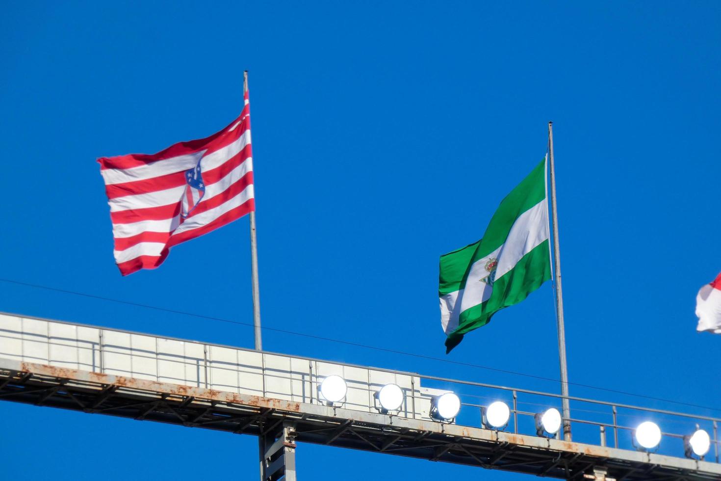 Flags of different countries and sports teams, flags with different coloured stripes. photo