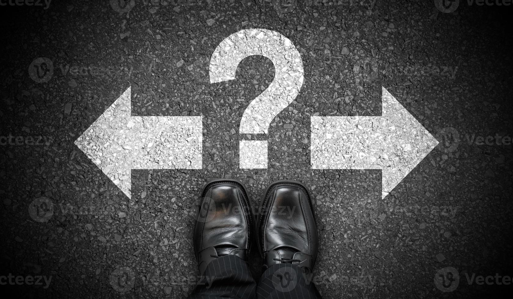 Black Business Shoes, Two Arrows and Question Mark - Problem Concept photo