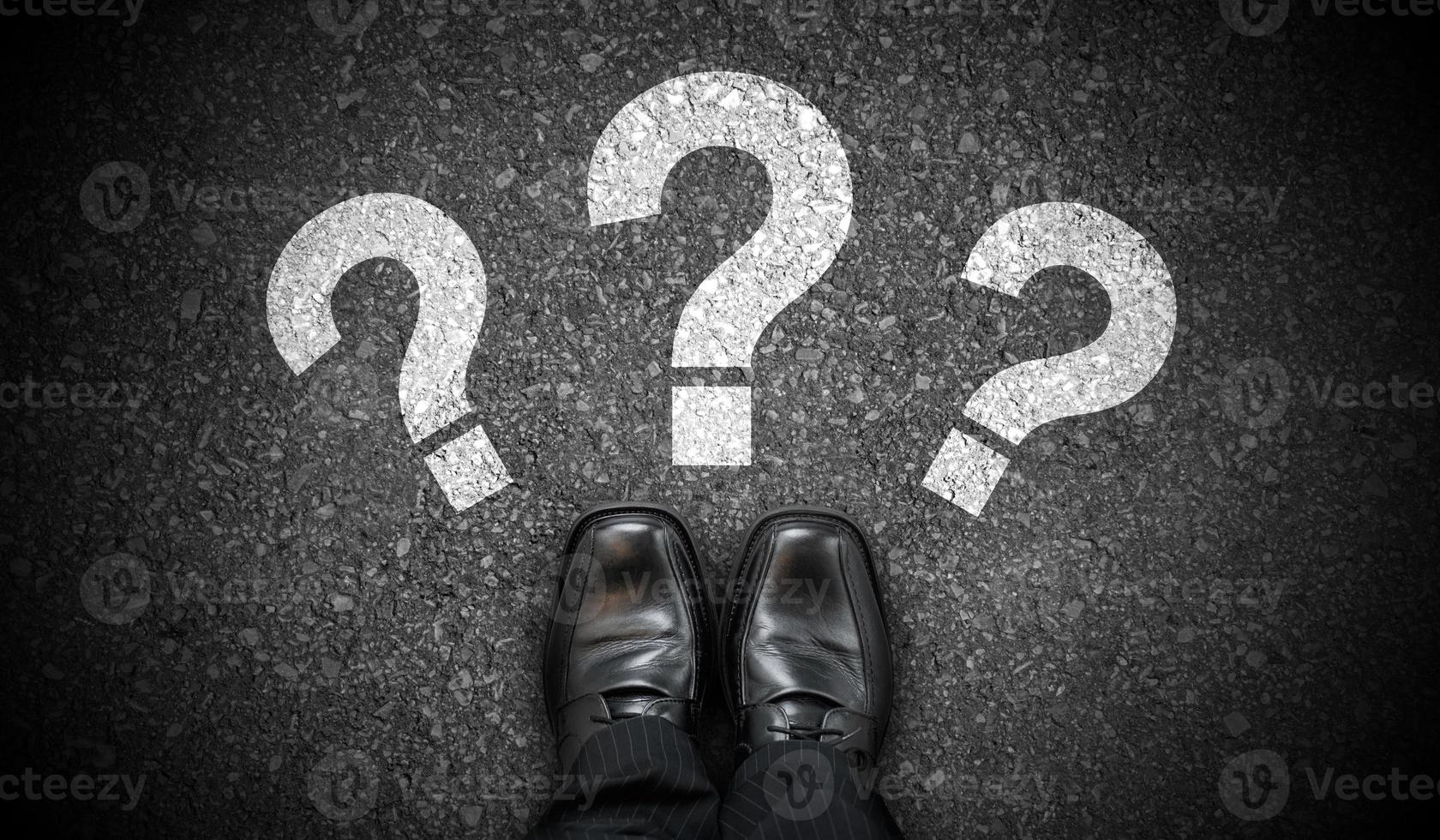 Black Business Shoes and Three Question Marks - Problem Concept photo
