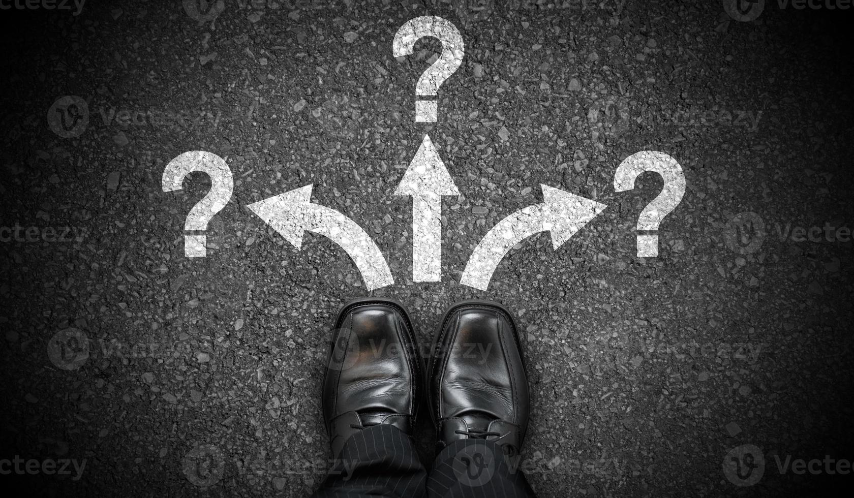 Black Business Shoes, Three Arrows and Question Marks - Problem Concept photo