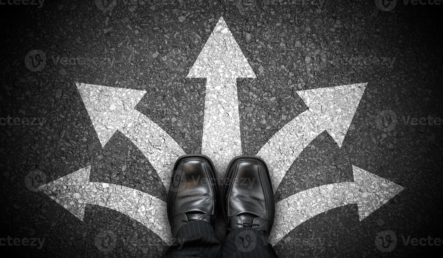 Black Business Shoes and Five Chalky Arrows on Asphalt - Choice Concept photo