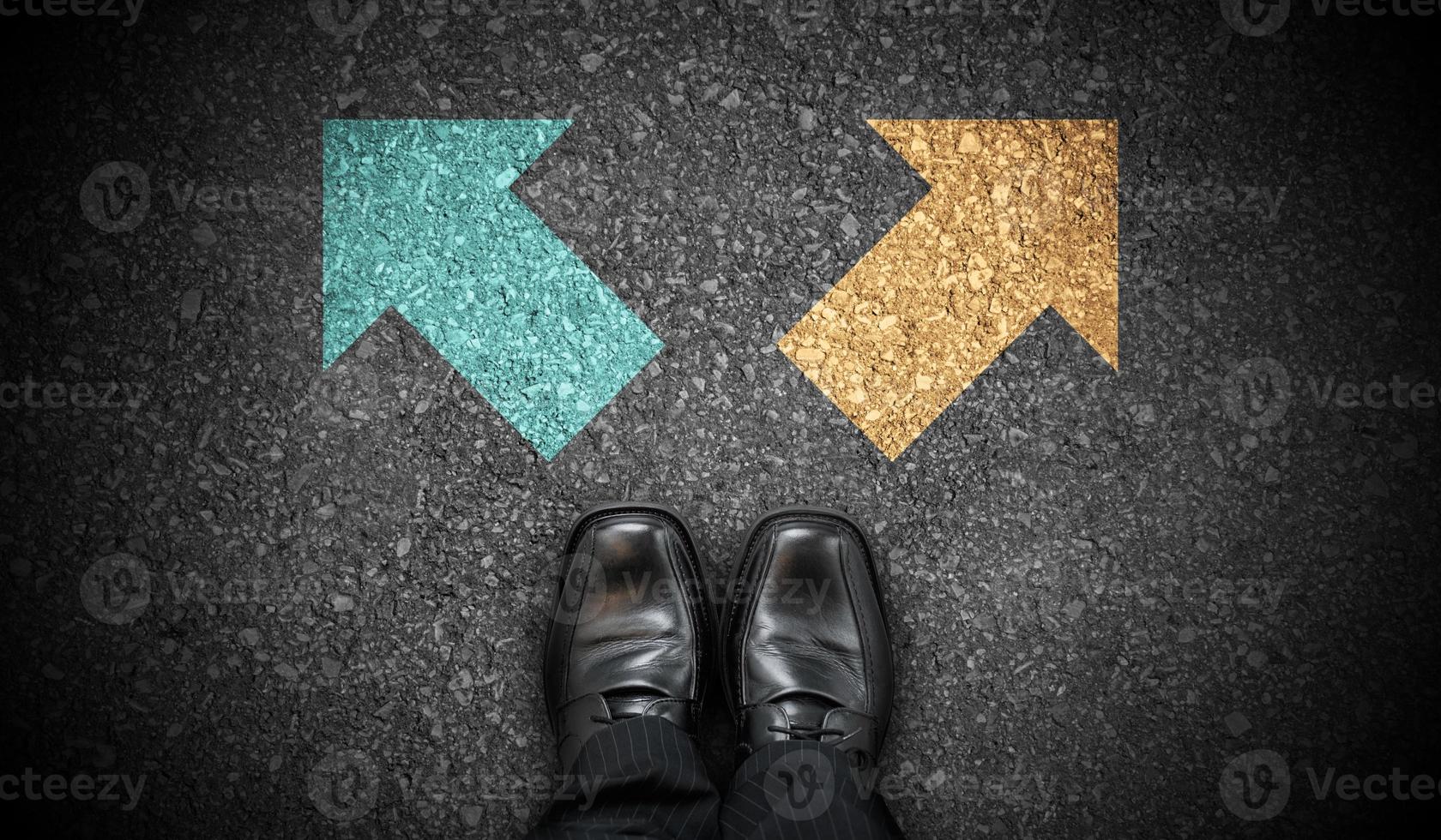 Black Business Shoes and Two Colorful Chalky Arrows on Asphalt - Choice Concept photo