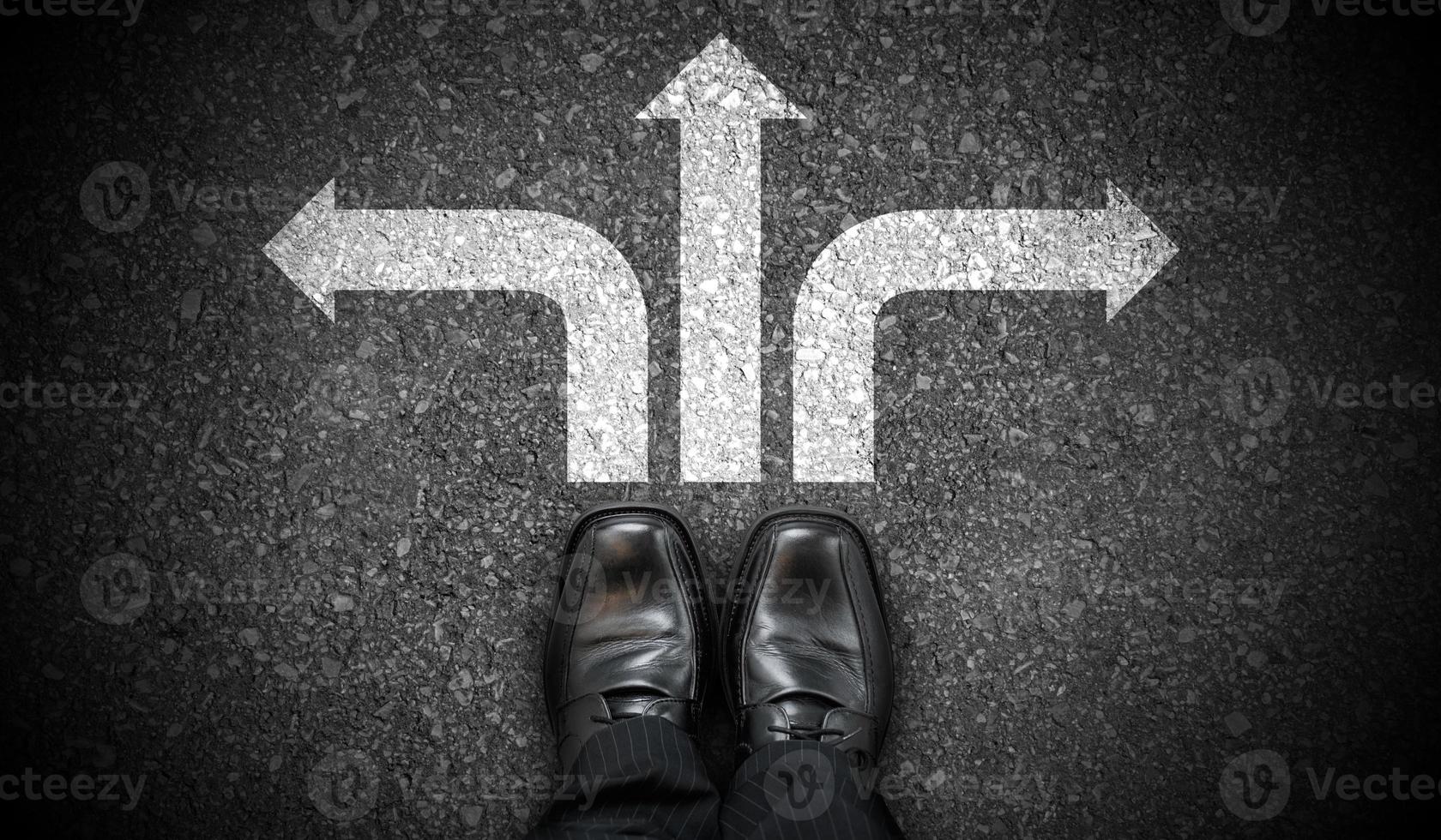 Black Business Shoes and Three Chalky Arrows on Asphalt - Decision Concept photo