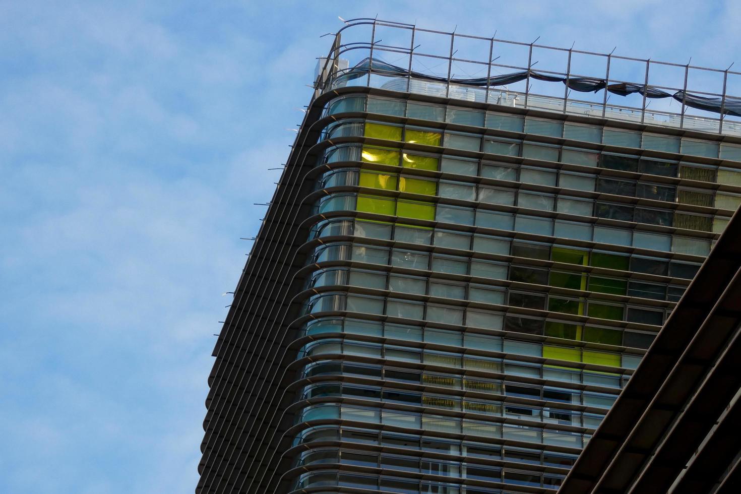 modern office building with coloured glass and palm trees photo