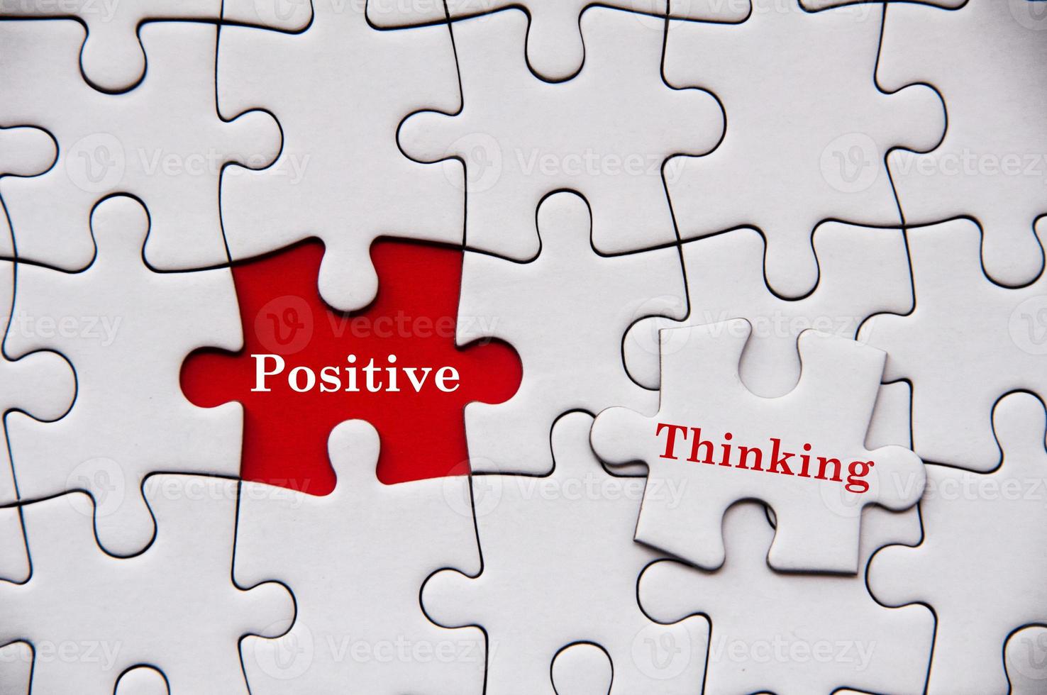 Positive thinking text on missing jigsaw puzzle. Motivational and inspirational concept photo