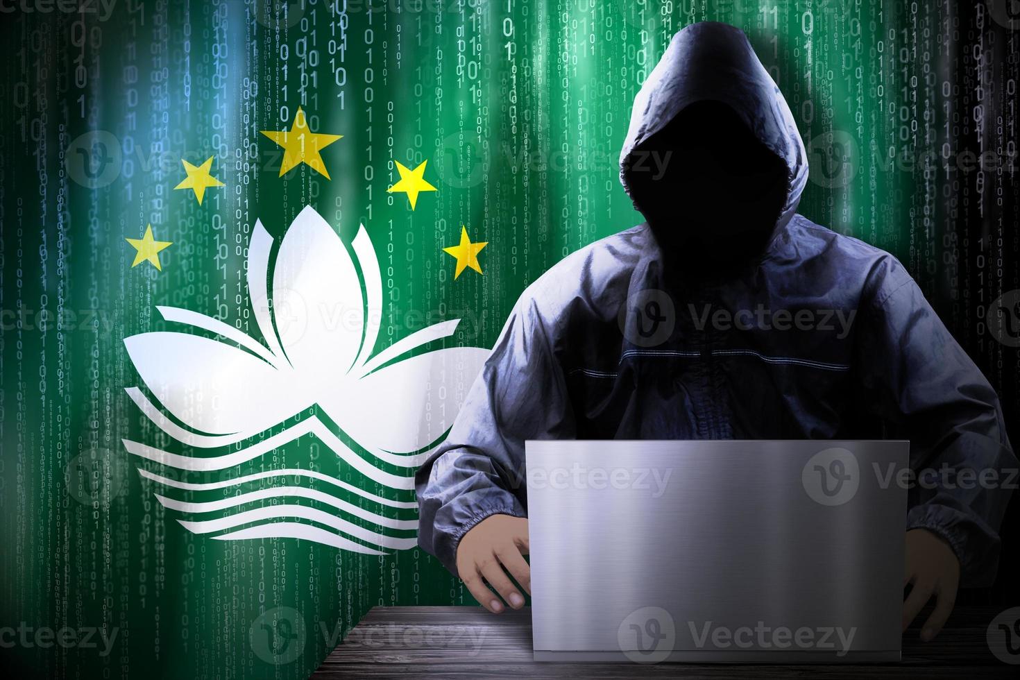 Anonymous Hooded Hacker and Flag Of Macau, Binary Code - Cyber Attack Concept photo