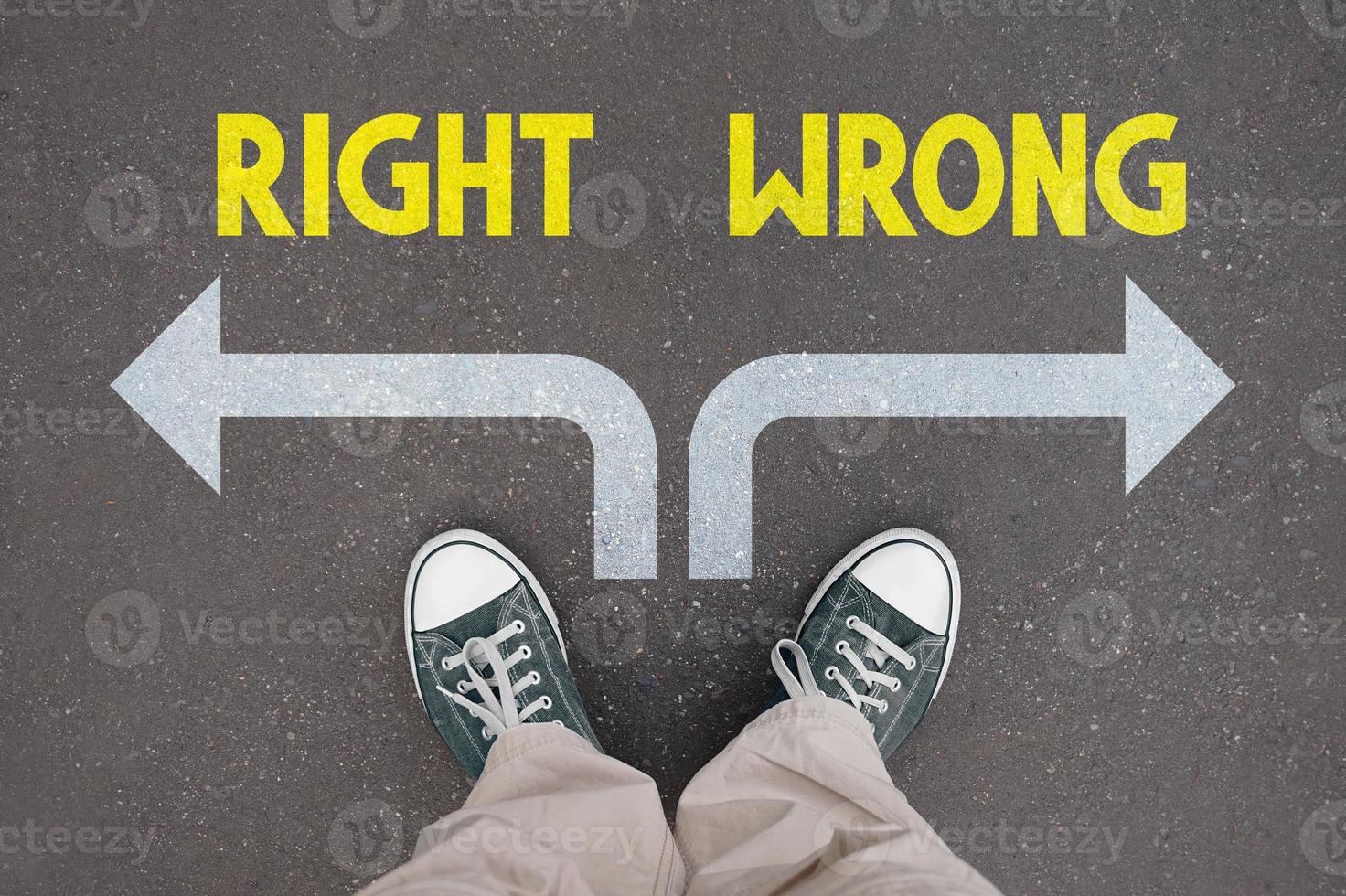Right and wrong concept - legs with trainer shoes photo