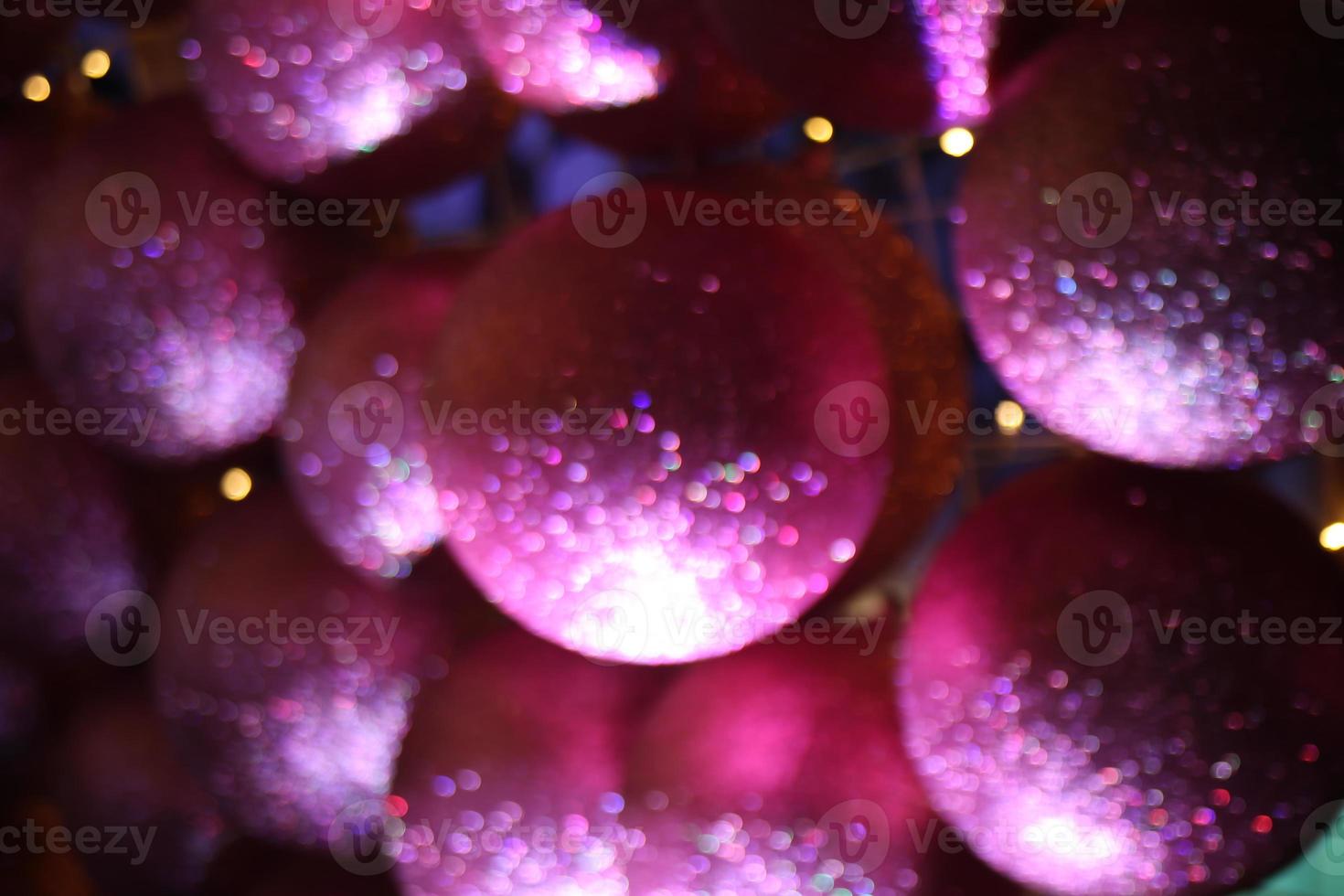 blur multicolored yellow green blue red abstract ball bokeh texture on black background. Festive defocused lights. photo