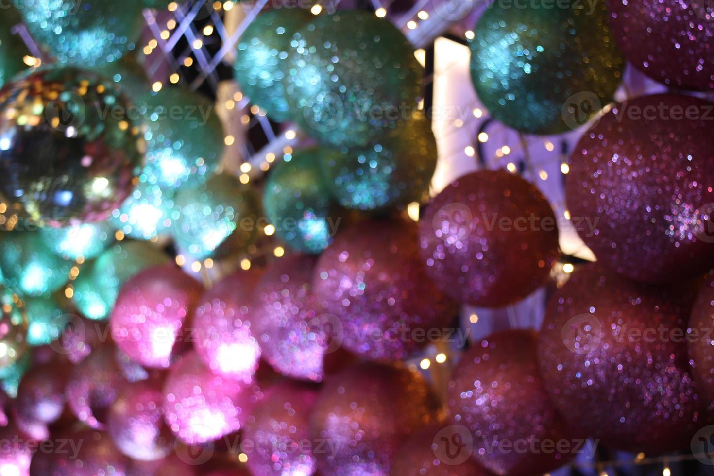blur multicolored yellow green blue red abstract ball bokeh texture on black background. Festive defocused lights. photo