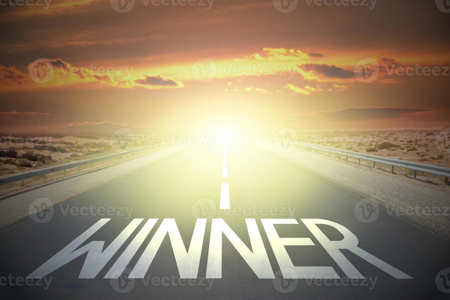 Winner word on a road and sunset sky photo