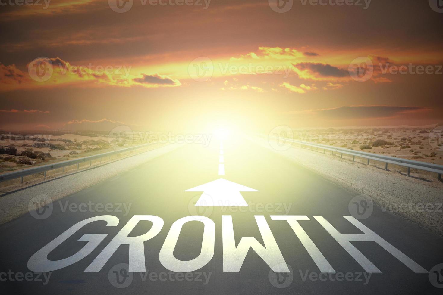 Growth word on a road and sunset sky photo