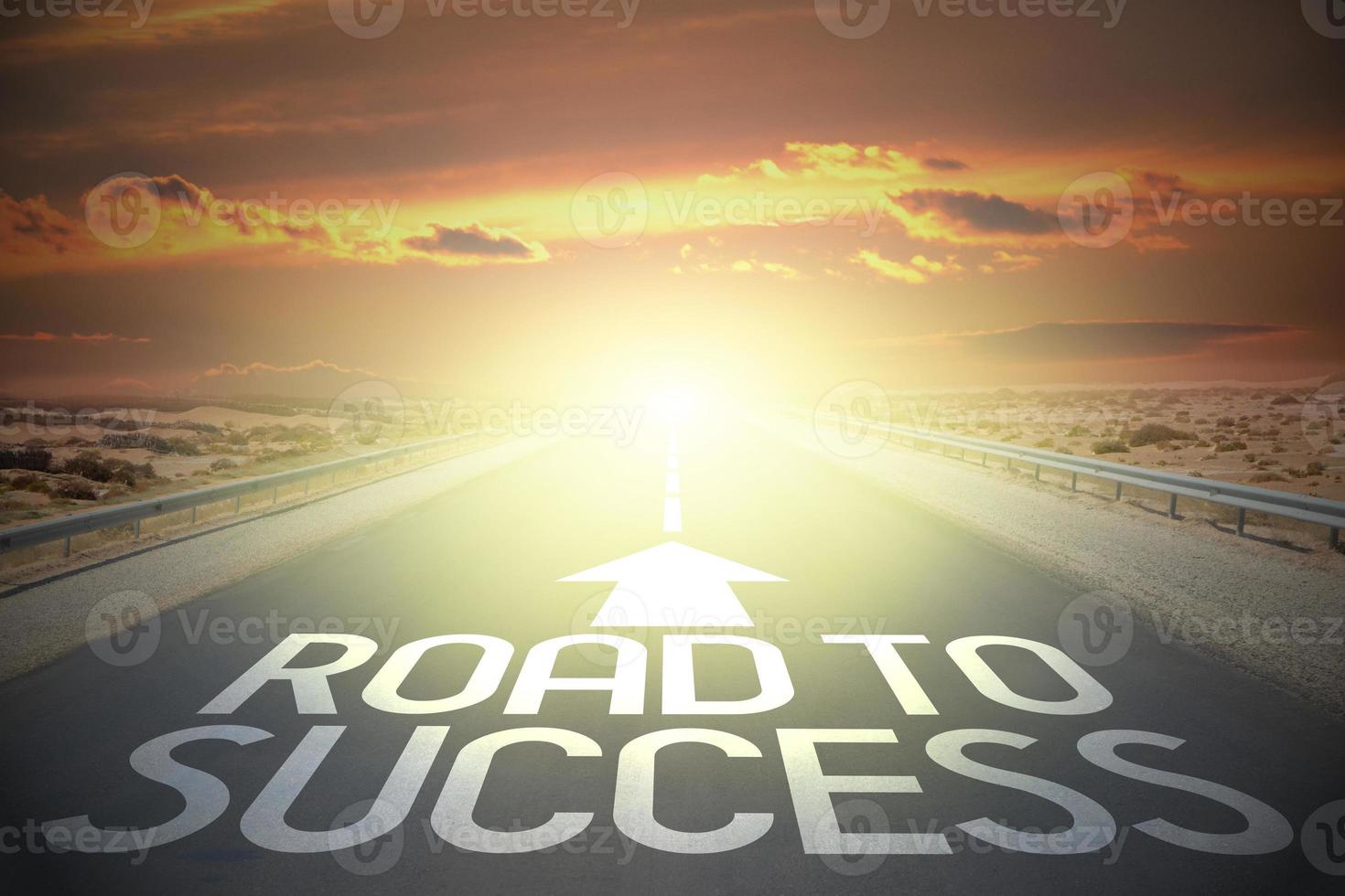 Road to success word on a road and sunset sky photo