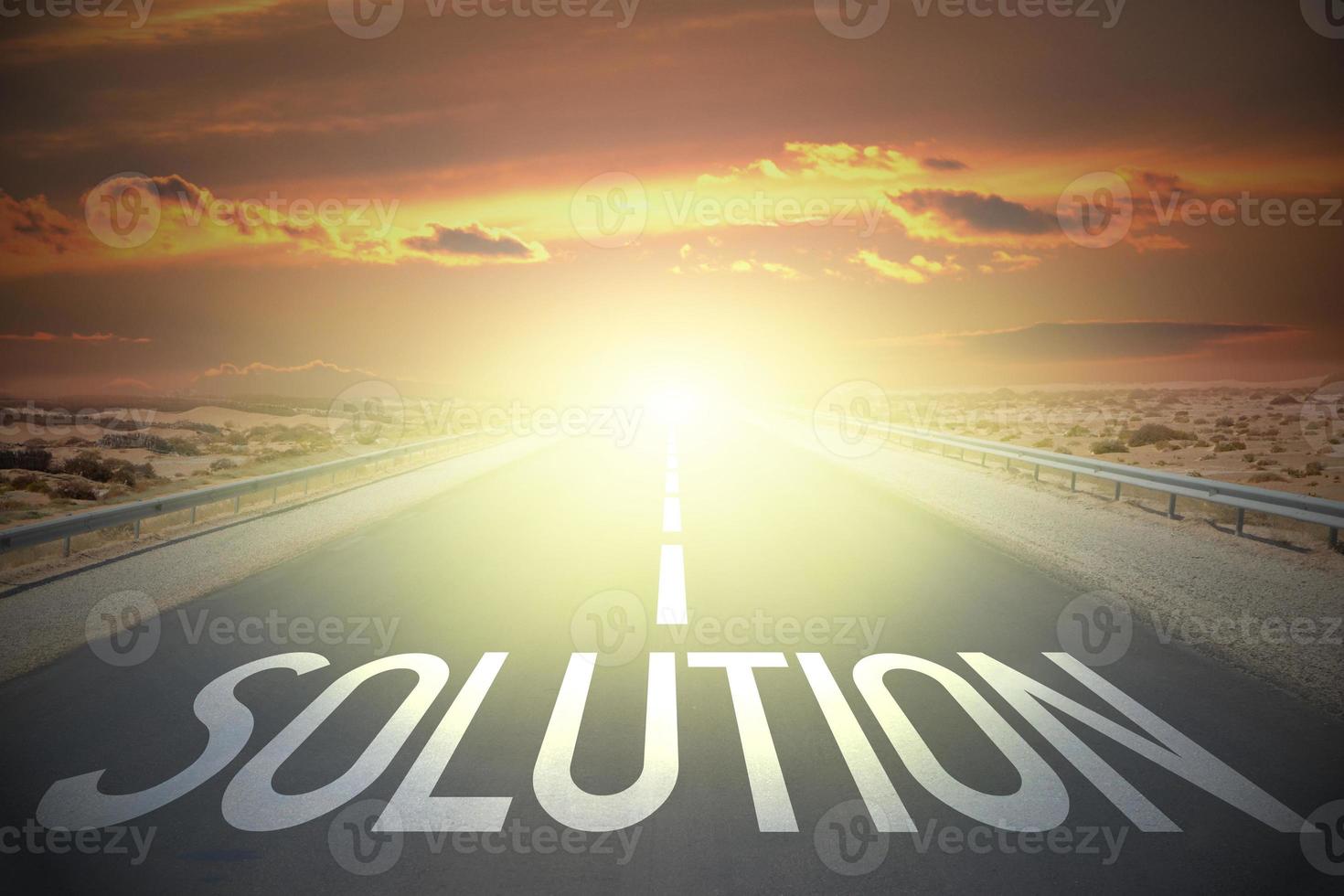 Solution word on a road and sunset sky photo