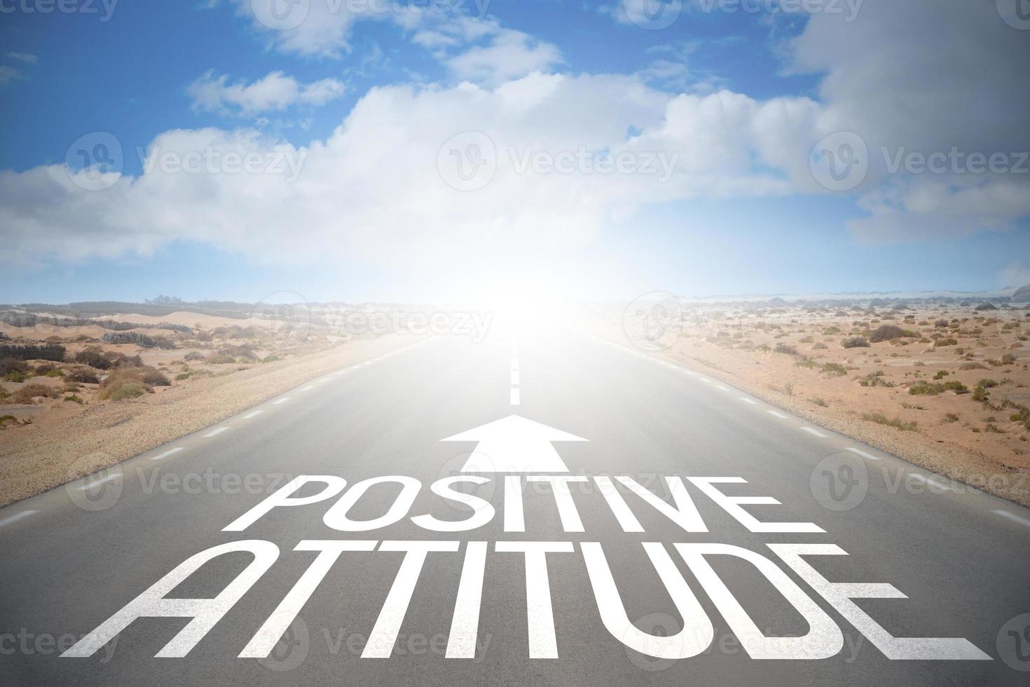 Positive Attitude Word on A Road and Sky with Clouds photo