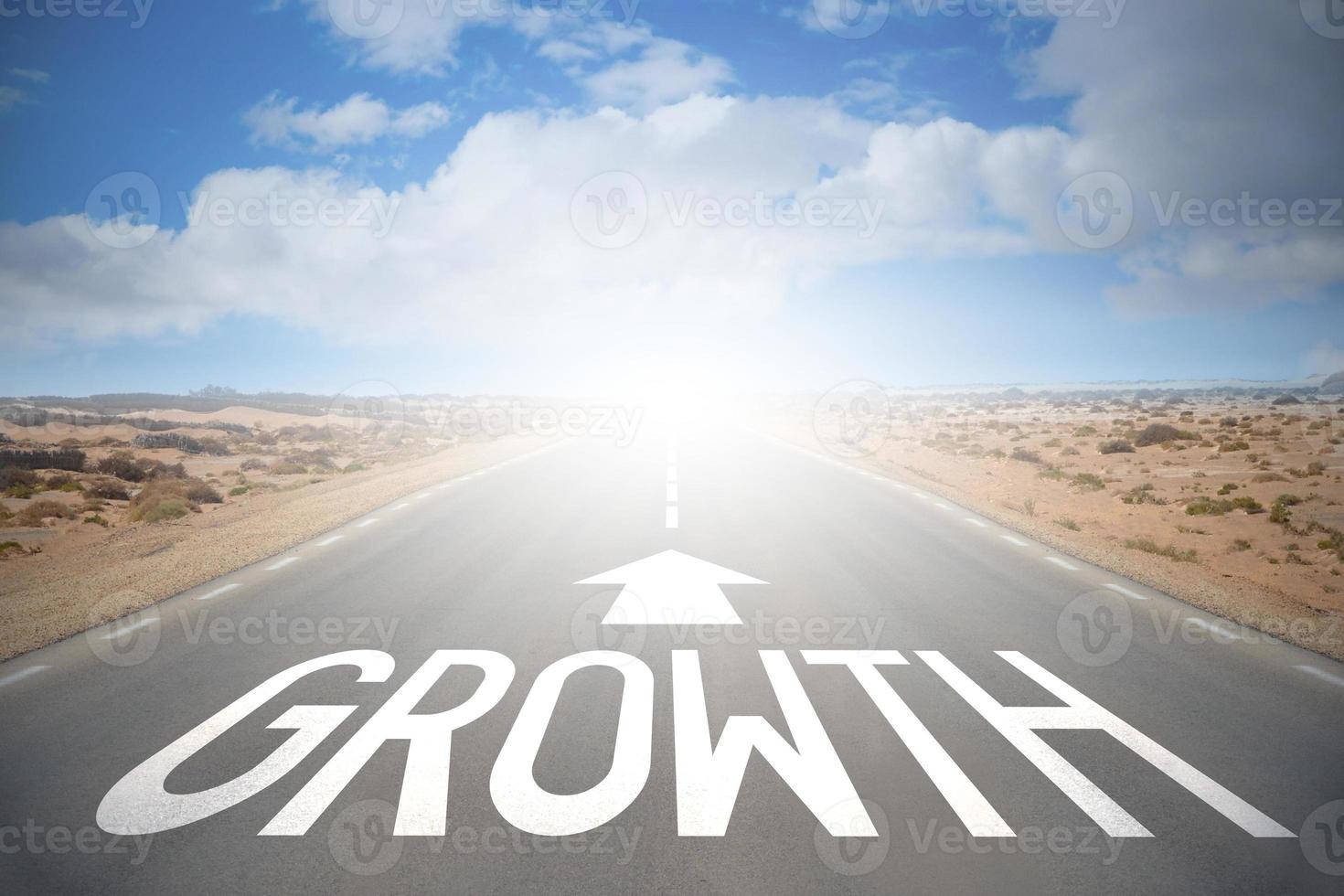 Growth Word on A Road and Sky with Clouds photo