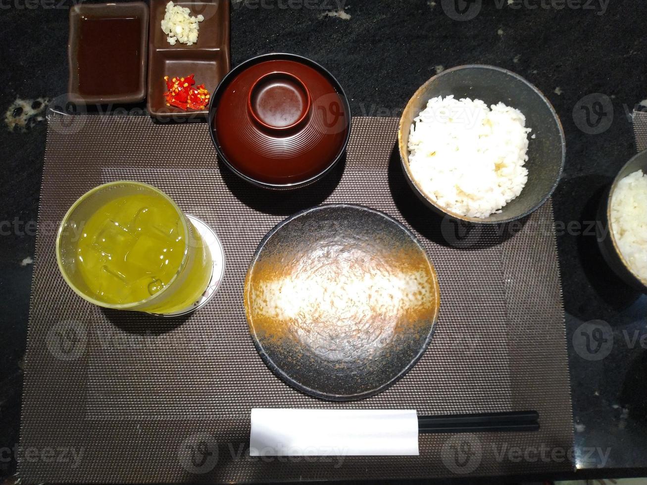 japanese food set with miso soup , green tea and rice with chopstick photo