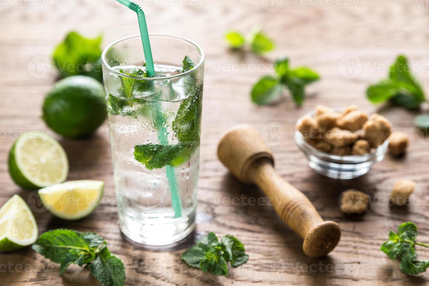 Glass of mojito with ingredients photo