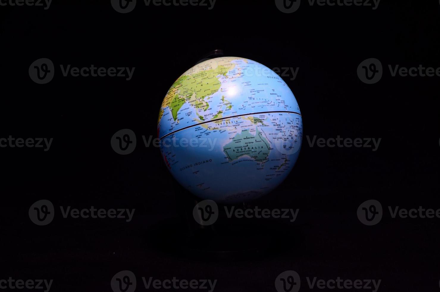 Globe on dark background photo