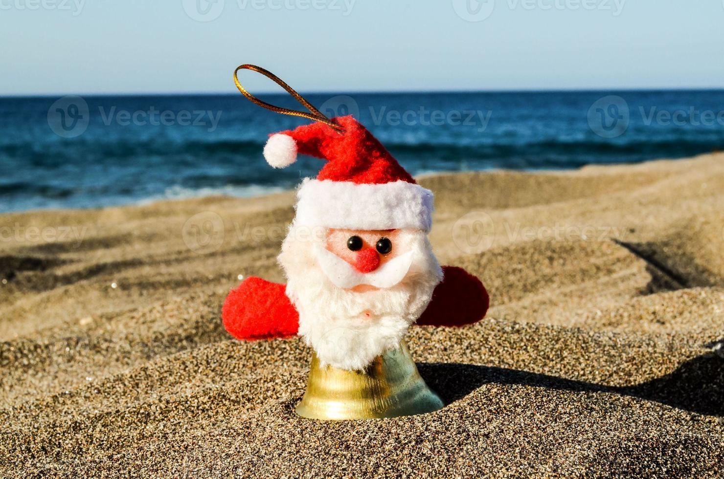 Santa ornament in the sand photo