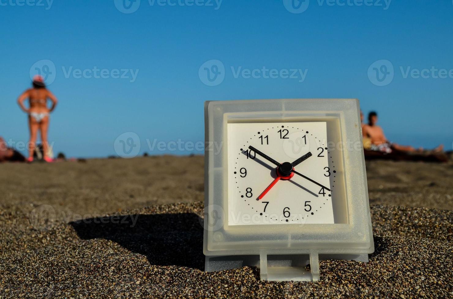 Clock in the sand photo